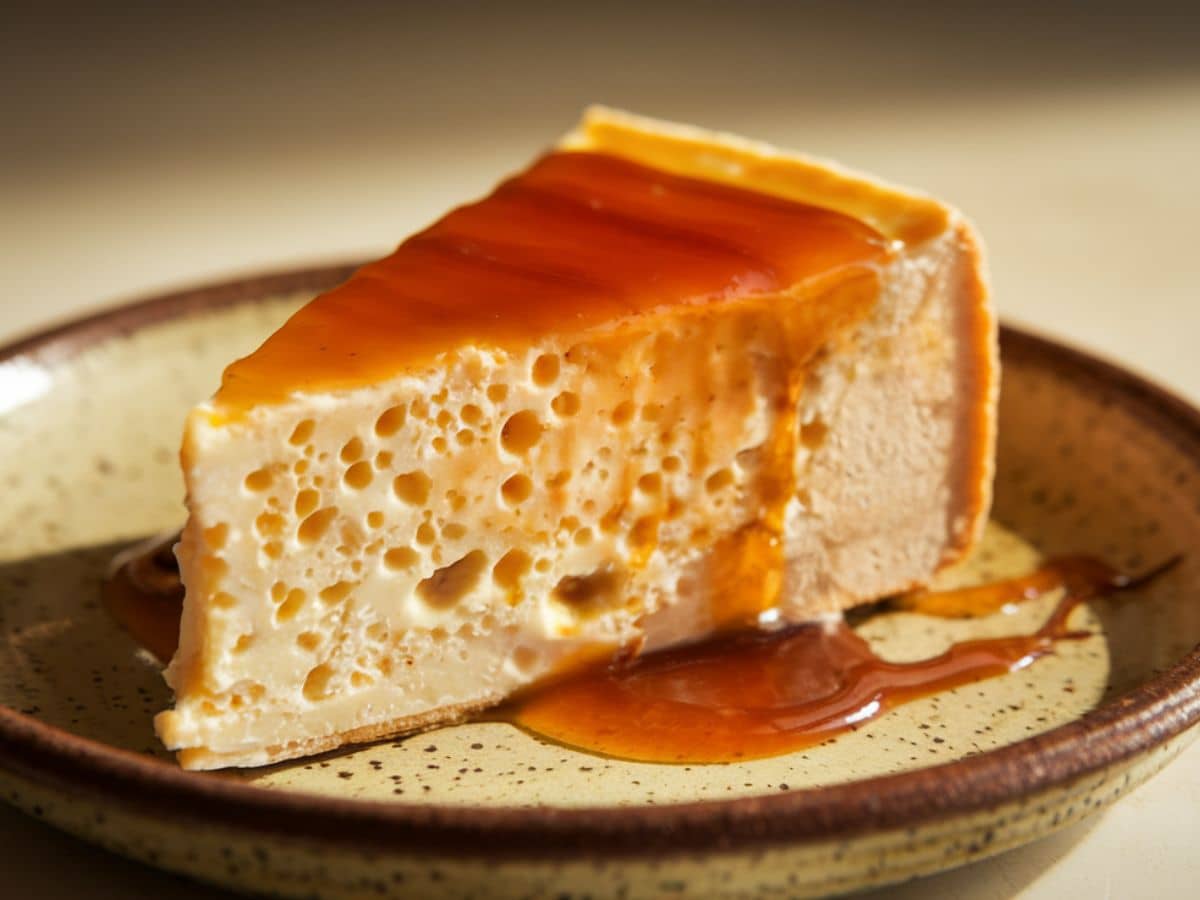Venezuelan quesillo dessert with rich caramel topping on display.